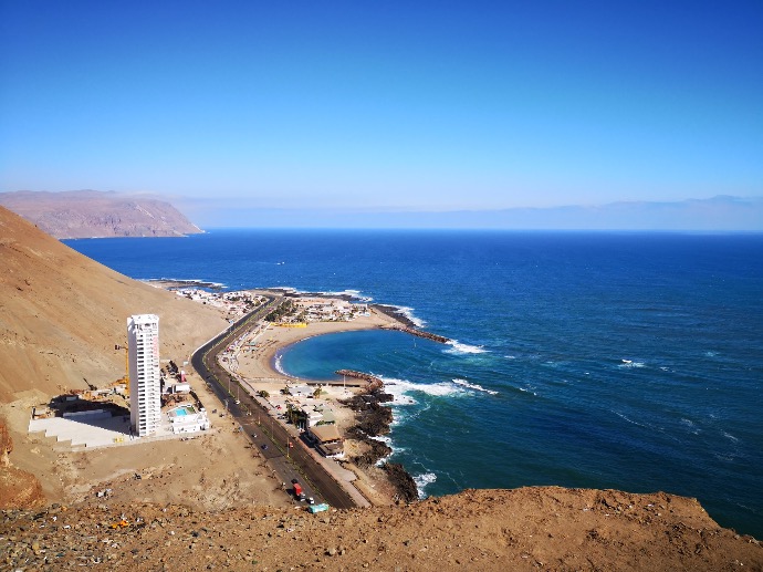 aerial view of city buildings near sea during daytime